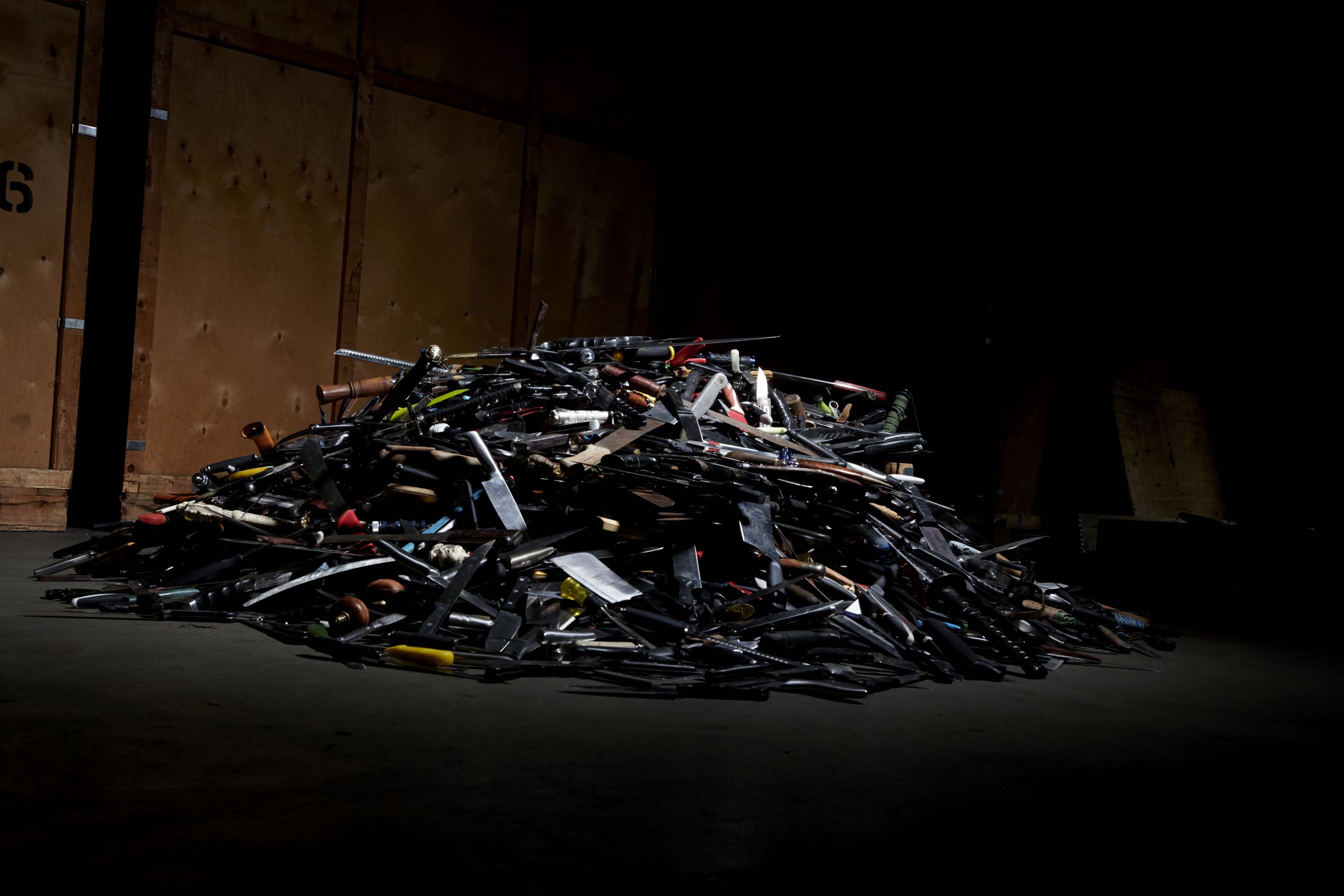 A pile of collected knives in the warehouse
